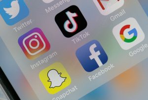 Meta -- the owner of Facebook and Instagram -- and TikTok have both insisted that they are not blocking or limiting the spread of pro-Palestine content. (Photo by Chesnot/Getty Images)